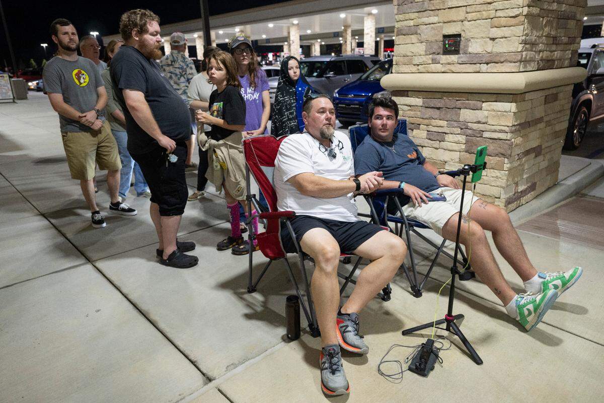 Fans of travel stop chain Buc-ee’s wait outside the newest location, located in Harrison County, MS, before the grand opening on Monday, June 9, 2025.