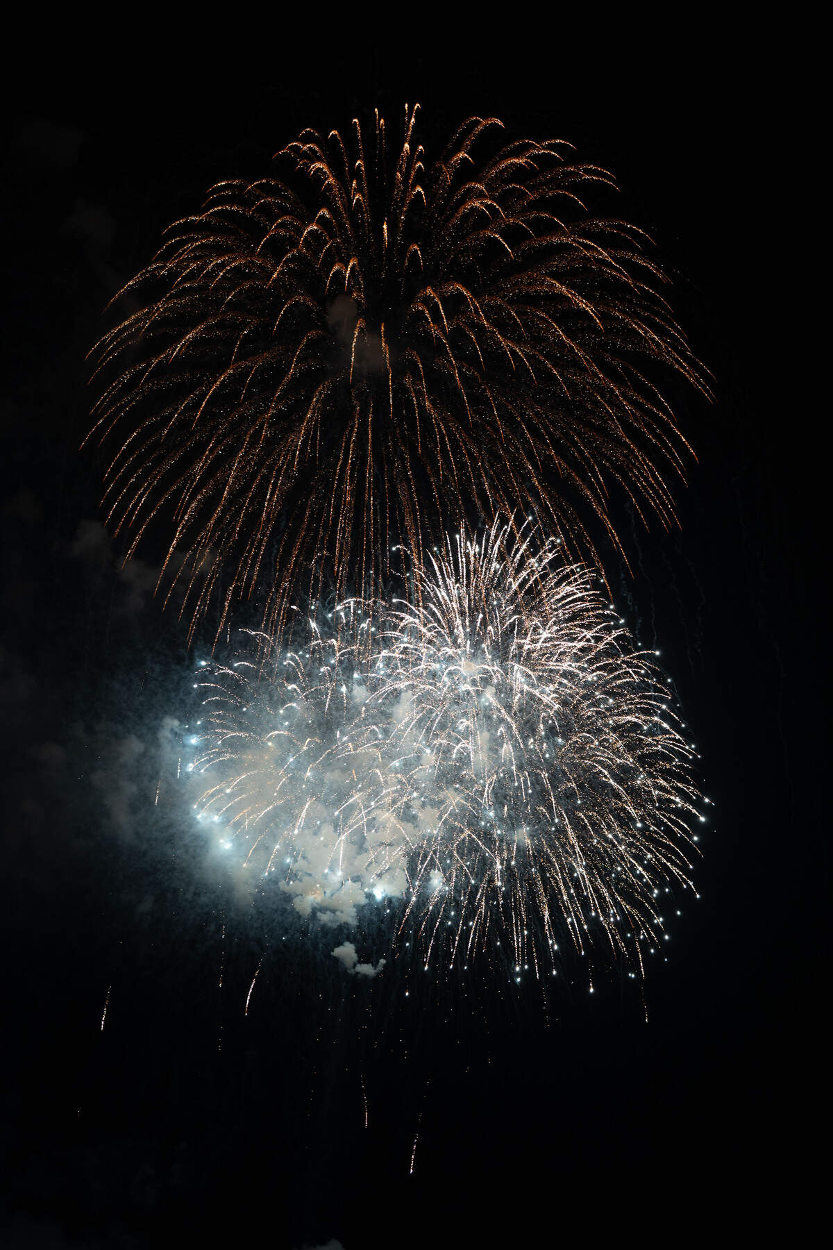 Fireworks are shot into the air during the annual show over the Mississippi Sound on Saturday, July 4, 2026.