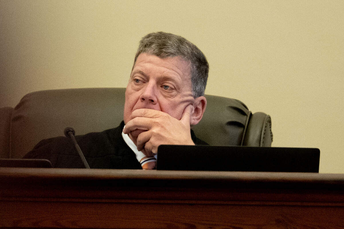 Judge Christopher Schmidt listens as a witness testifies Thursday.