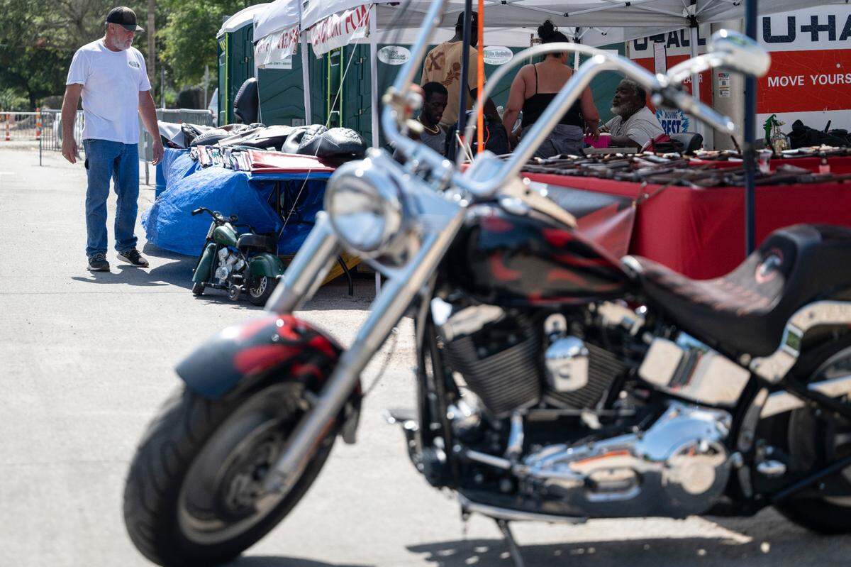 Motorcycle lovers walk among motorcycles and vendors at Bikin’ The Beach in 2005. After schedule problems in Biloxi last year, the event moves to Long Beach this year.