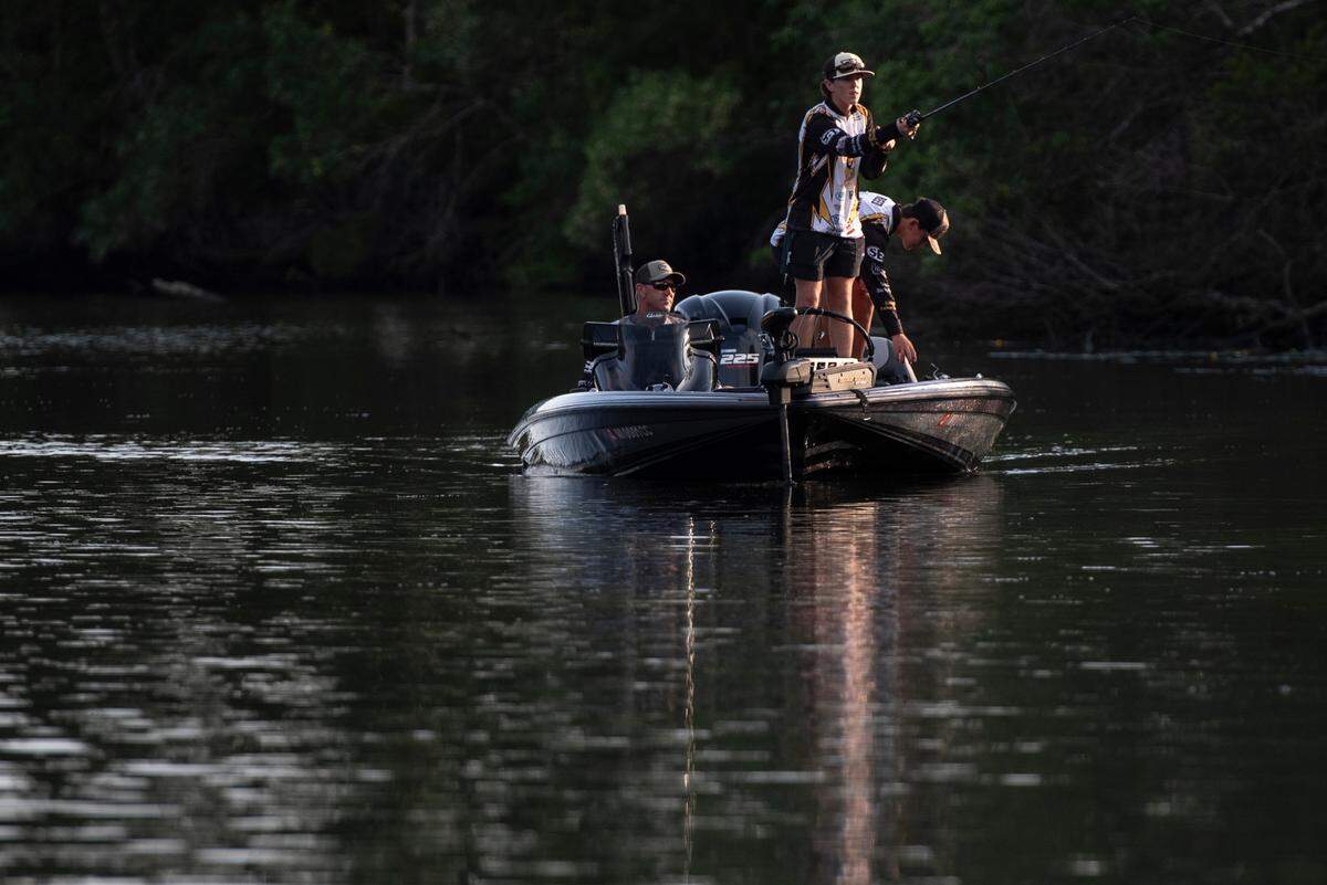 D’Iberville Bass Fishing Team members Cooper Rouse, center, and Ryker Reed, right, fish on the Tchoutacabouffa River with Brian Rouse, Cooper’s father and their coach, in D’Iberville on Monday, June 3, 2024. Reed and Rouse took home their second consecutive bass fishing state championship title in May.