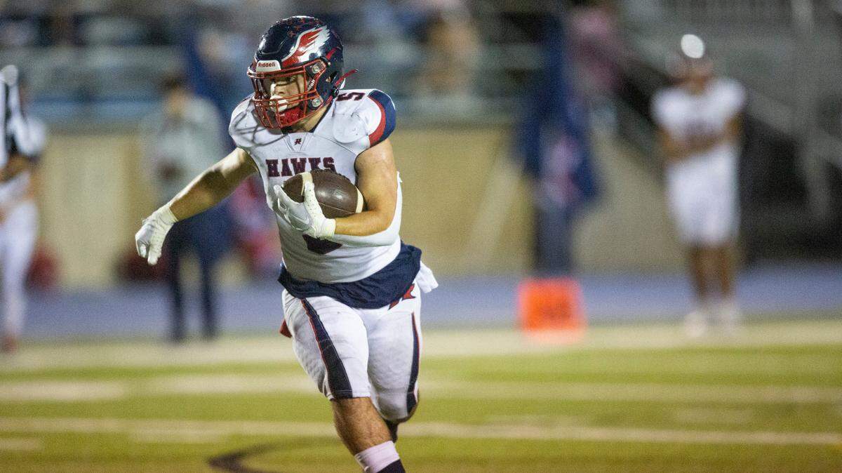 Hancock’s Zach Gullung carries the ball down the field during a game against St. Martin at Joe Barlow Stadium in St. Martin on Friday, Sept. 30, 2022.