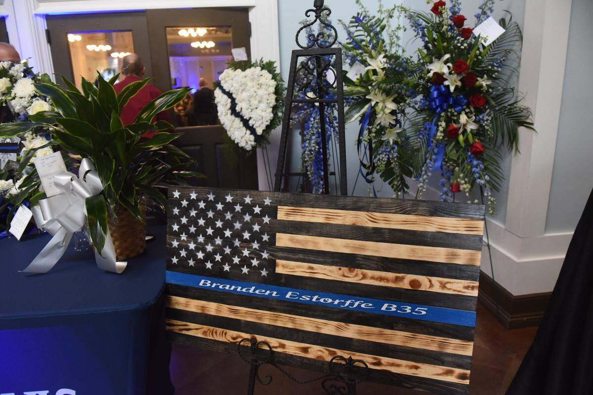 A police flag etched with officer Branden Estorffe’s name is in on display at funeral services for Estorffe and Sgt. Steven Robin, both Bay St. Louis police officers killed in the line of duty.