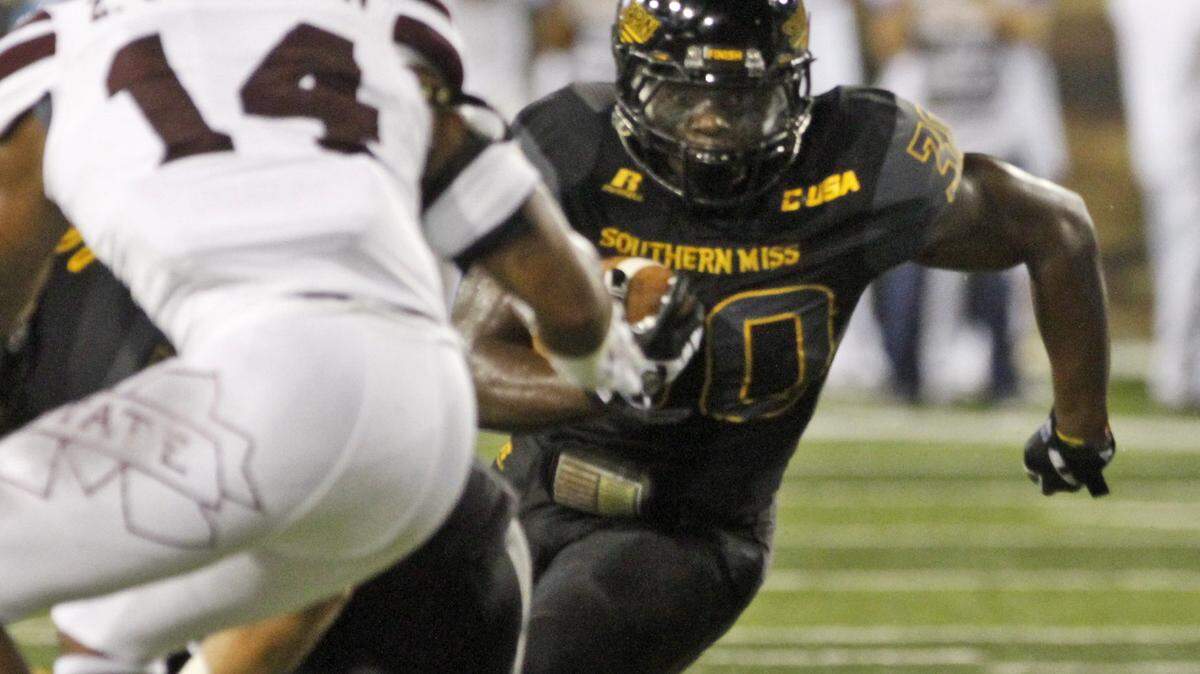 TIM ISBELL/SUN HERALD 
 USM running back Jalen Richard carries the ball against Mississippi State on Saturday, Sept. 5, 2015.