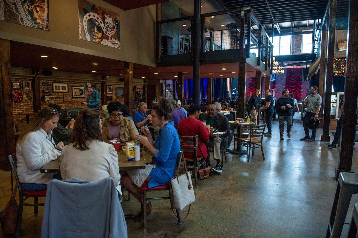 City workers and first responders dine during a preview lunch of the new Ground Zero Blues Club music venue in Biloxi on Thursday, Feb. 10, 2022.