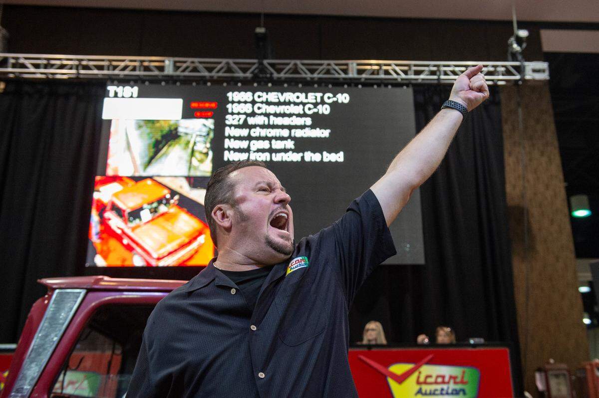 Ringman Marty Hill yells as a bidder places a bid on a car during the Vicari car auction at Mississippi Coast Coliseum and Convention Center on Thursday, Oct. 7, 2021.
