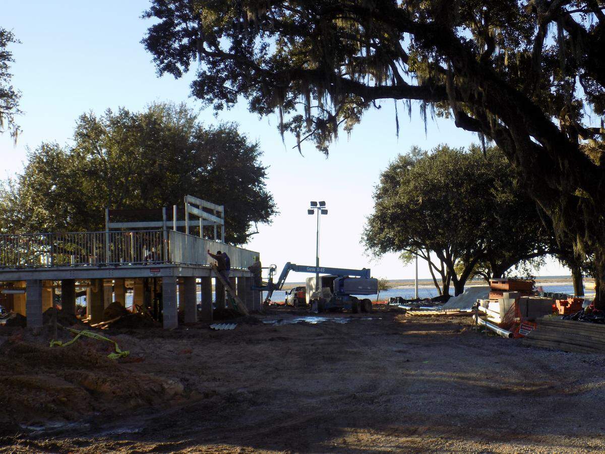 An elevated Waffle House is going up under the oak trees across from the beach on U.S. 90 in Biloxi, Two new hotels will open this year next to it.
