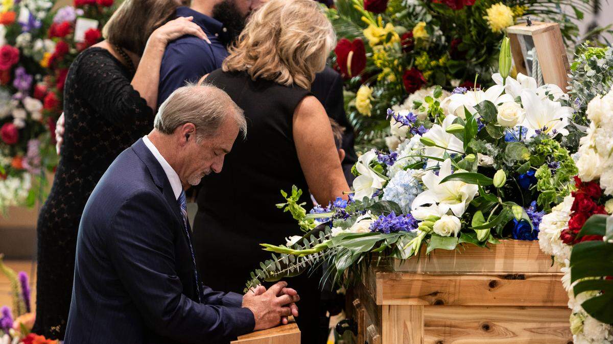 Bay St. Louis Councilman Doug Seal kneels and prays at the casket of his son, 28-year-old Cayce Seal, an Entergy lineman who died after an electric shock while working on power lines. Cayce’s funeral services were held at St. Clare Catholic Church in Waveland on July 1, 2021.