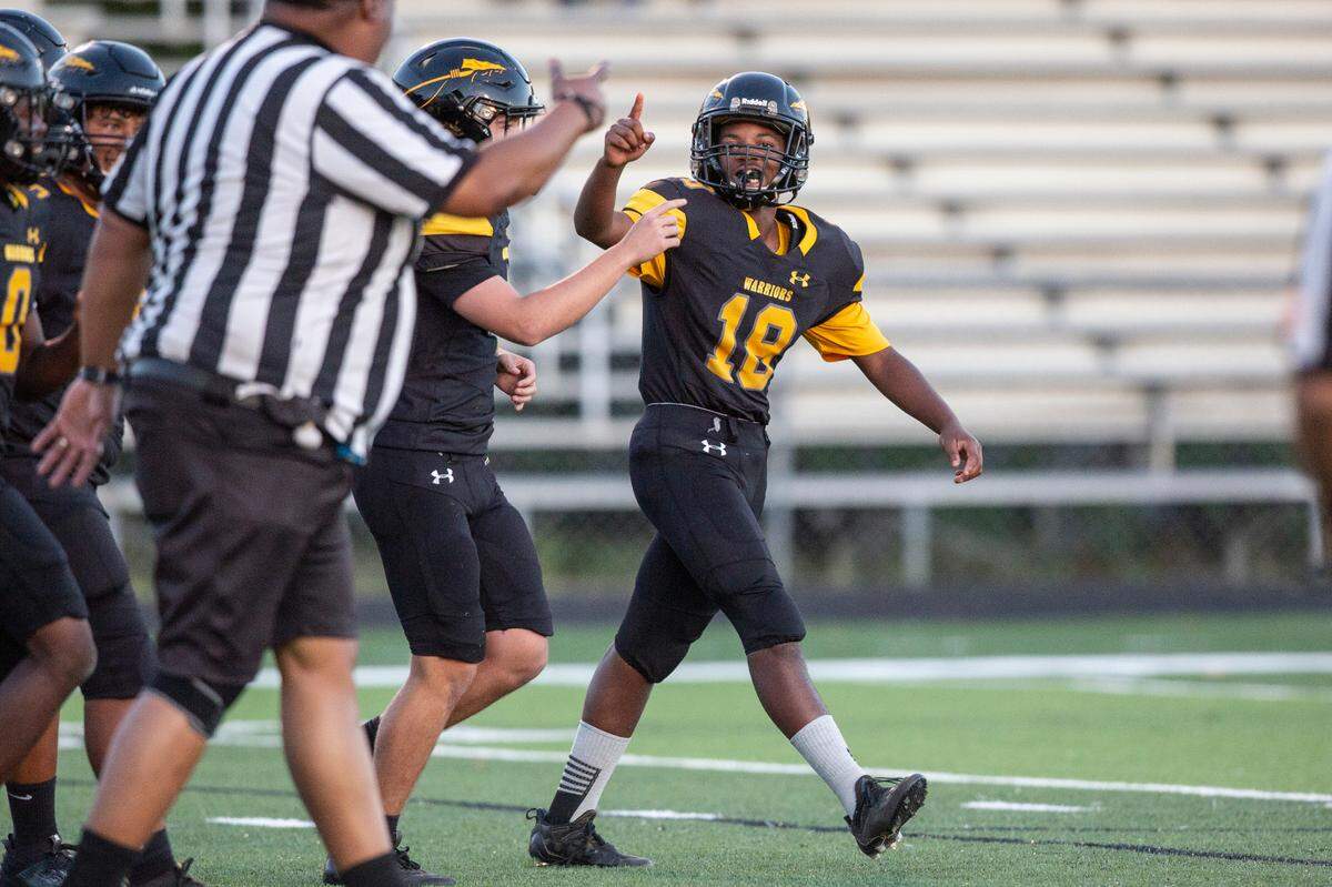 Tyler Hunter, the student manager for D’Iberville’s JV football team, celebrates after scoring against St. Martin at Warrior Stadium in D’Iberville on Monday, Oct. 9, 2023. Hunter, who has an intellectual disability, played for two of the game’s plays, scoring two touchdowns.