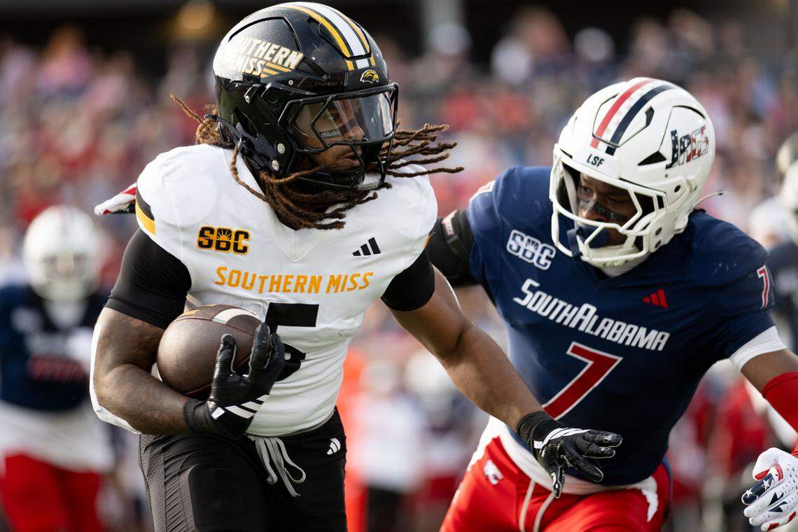 Southern Mississippi running back Matt Jones (5) looks for open space Saturday after hauling in a screen pass.