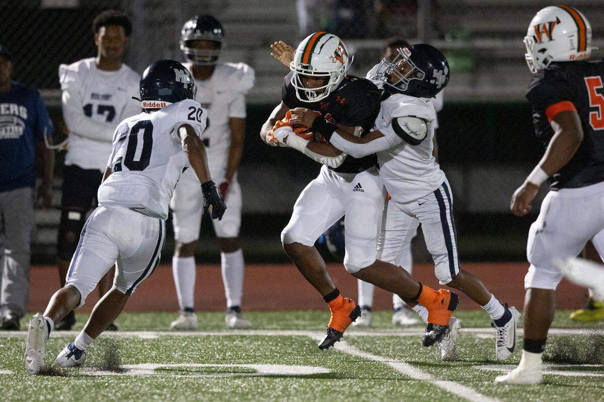 West Harrison Hurricanes’ Trey Harris gets tackled during a game against Moss Point at West Harrison High School in Gulfport on Friday, Sept. 22, 2023.