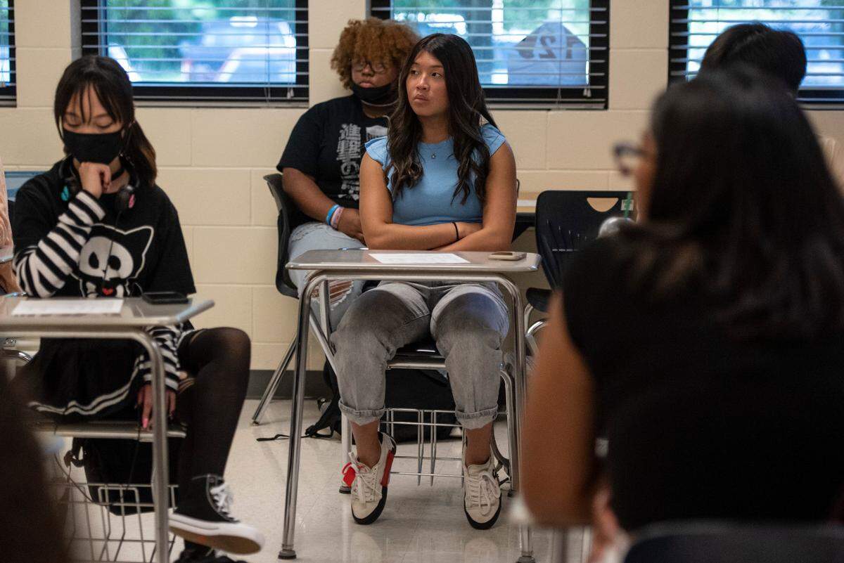 High school students listen to teacher Colleen Barr during their homeroom class on the first day of school at Ocean Springs High School in Ocean Springs on Friday, Aug. 5, 2022.
