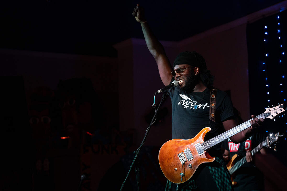 Twurt Chamberlain points up as he closes out his set during a Juneteenth celebration at 100 Men Hall in Bay St. Louis on Friday, June 19, 2026.