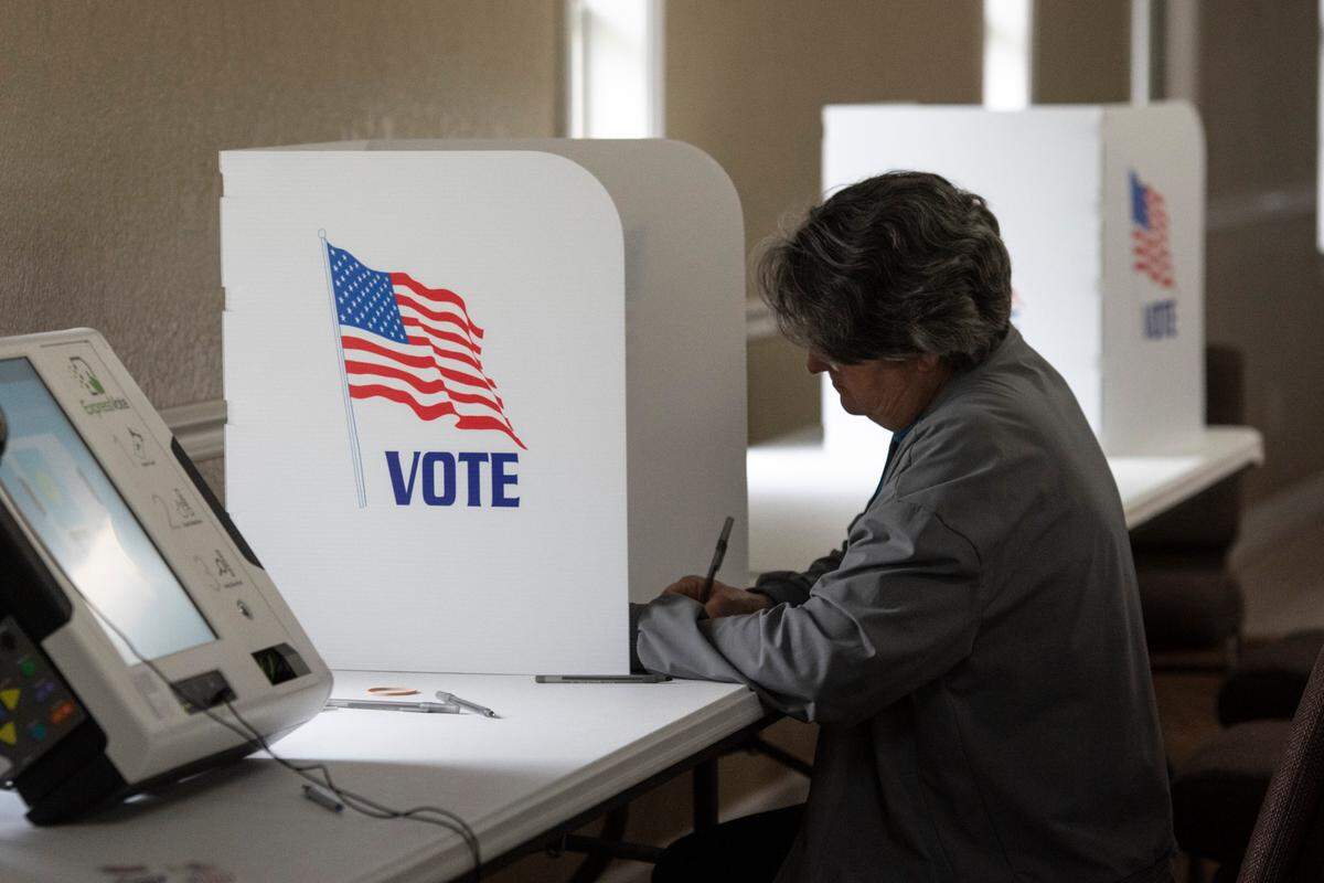 A voter casts a ballot at Grace Baptist Church in Ocean Springs during the municipal primary election on Tuesday, April 1, 2025.