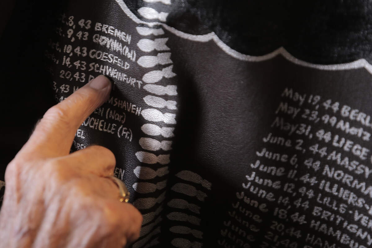 George Roberts, 100, showed a replica of his bomber jacket he wore while in the U.S. Army Air Force as a radio operator during World War II. All of his 31 bombing missions over Germany are listed on the back of the jacket. The original is now in a museum.