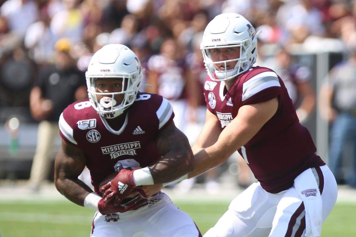 Mississippi State quarterback Tommy Stevens hands off the ball to running back Kylin Hill against Southern Miss Sept. 7, 2019.