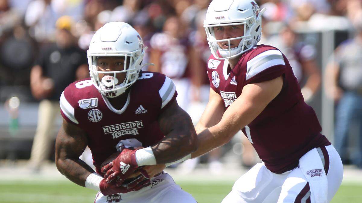 Mississippi State quarterback Tommy Stevens hands off the ball to running back Kylin Hill against Southern Miss Sept. 7, 2019.