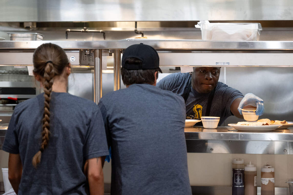 Food is served from the kitchen during the opening day of The Downtowner in Gulfport on Tuesday, June 9, 2026.