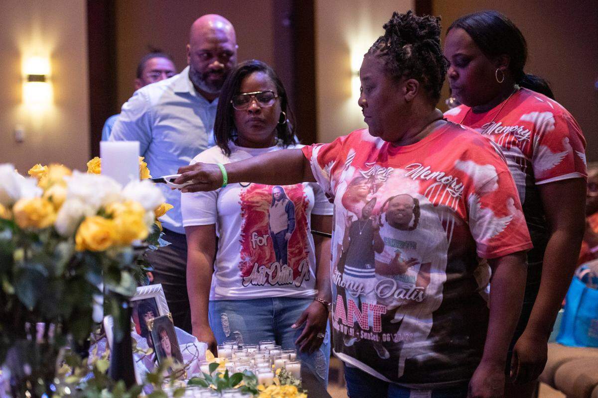 Tomica Samuel lights candles in front of a portrait of her son, Anthony Oatis, during a coast-wide candlelight ceremony as a part of National Crime Victims’ Rights Week at First Baptist Church of Gulfport on Tuesday, April 29, 2025. Oatis was killed in June of 2022.