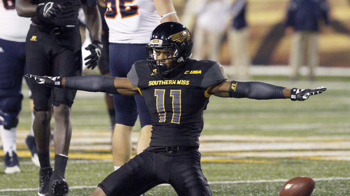 TIM ISBELL/SUN HERALD 
 Southern Miss defensive back Kalan Reed signals incomplete after breaking up a pass to UTAS's David Morgan II, Saturday, Oct. 17, 2015.
