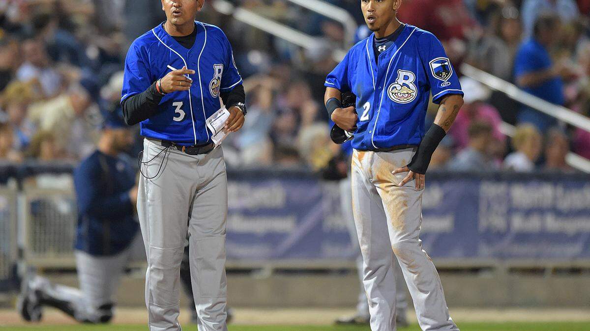 GLENN ANDREWS/SPECIAL TO THE SUN HERALD 
 Biloxi Shuckers manager Carlos Subero (3) checks his lineup card and Shuckers base runner Orlando Arcia (2) waits at third as the Pensacola Blue Wahoos make a pitching change in the sixth inning, Thursday, April 9, 2015, in Pensacola, Fla.