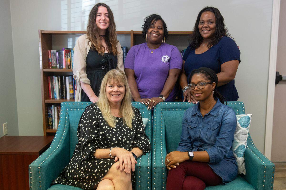 Staff of the Gulf Coast Center for Nonviolence pose for a portrait in Biloxi on Wednesday, July 24, 2024. From left, first row: Stacey Riley, Chief Executive Officer and Patricia Boyou, Chief Clinical Officer. From left, second row: Melissa Galatas, Justice for Families Program Manager, Myia Lane, Client Services Manager, and Nateshia Stubbs, Housing Program Manager.
