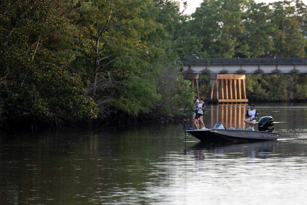 D’Iberville Bass Fishing Team members Olivia King and Harper Krohn fish on the Tchoutacabouffa River in D’Iberville with their Coach Hiram King on Monday, June 3, 2024.