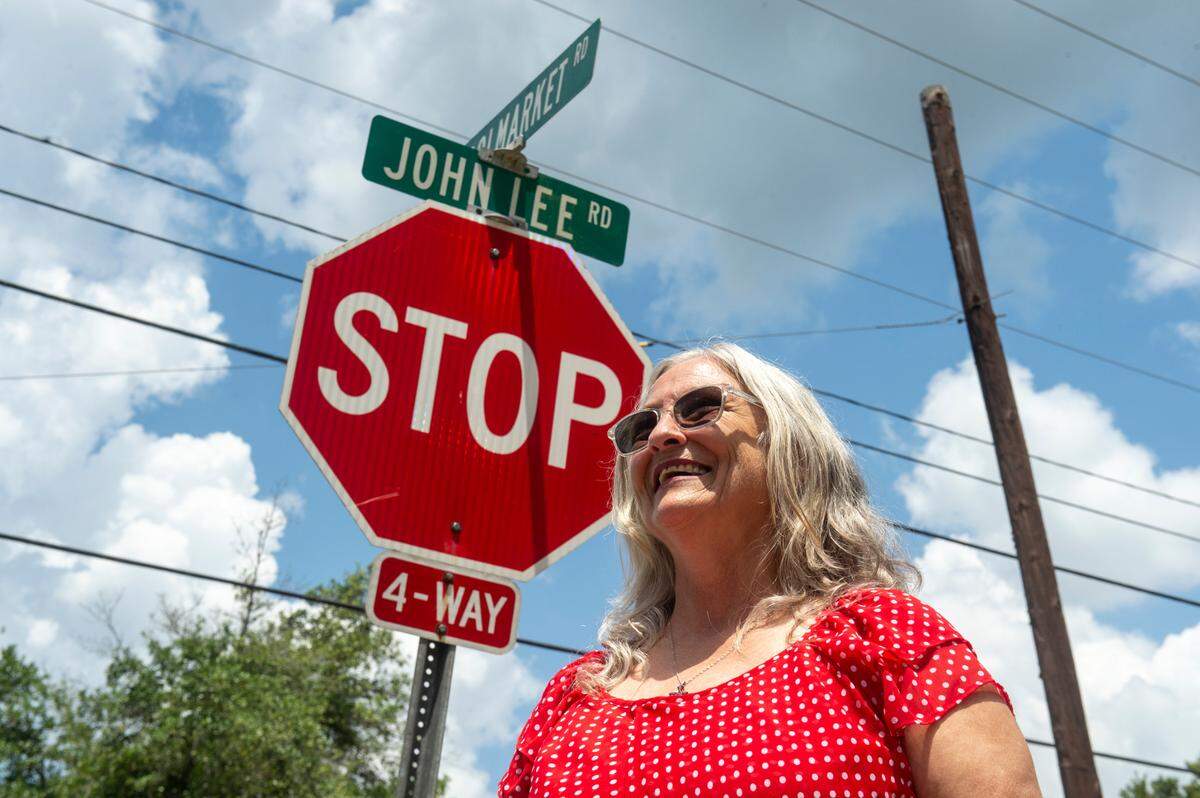 Connie Cushman stands on the corner of John Lee Road, which is named for her grandfather, on Monday, June 24, 2024.