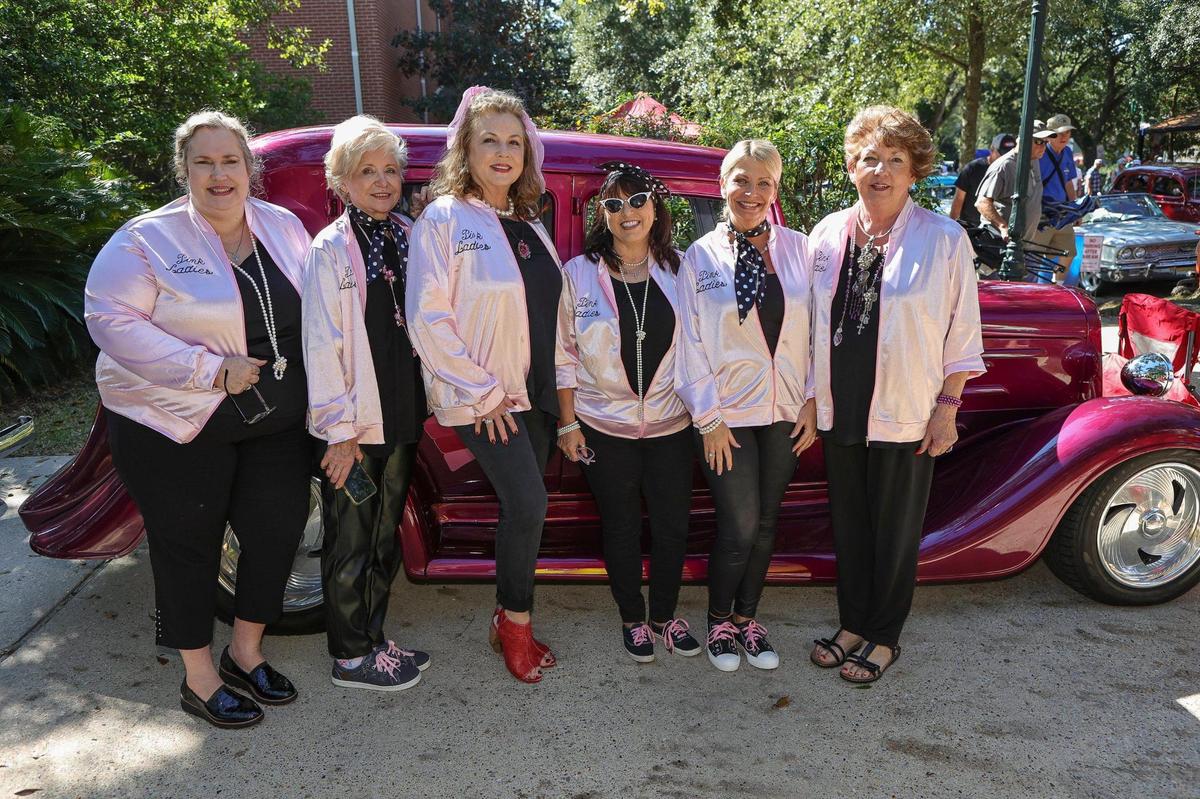 The “Pink Ladies” line up for a photo during the Ocean Springs Cruisin’ the Coast Block Party, October 8, 2021.