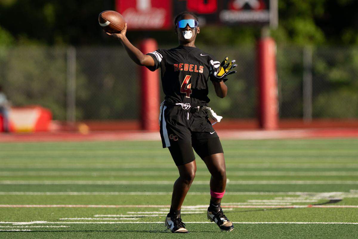 George County’s Ava Hall (4) passes the ball during a flag football playoff game at Biloxi High School on May 4.