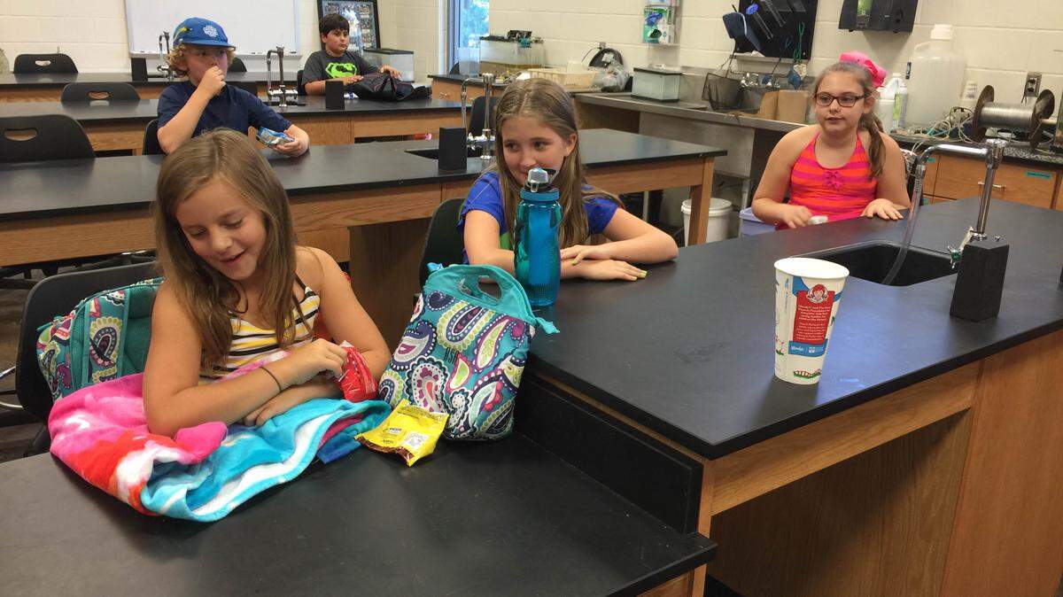 JEFF CLARK/SPECIAL TO THE SUN HERALDRiley Shorter, Cassady Bickham and Savannah Sempier prepare to visit an estuary in Ocean Springs Monday. The Ocean Springs Upper Elementary students are participating in an after-school marine biology program at the USM Gulf Coast Research Laboratory.