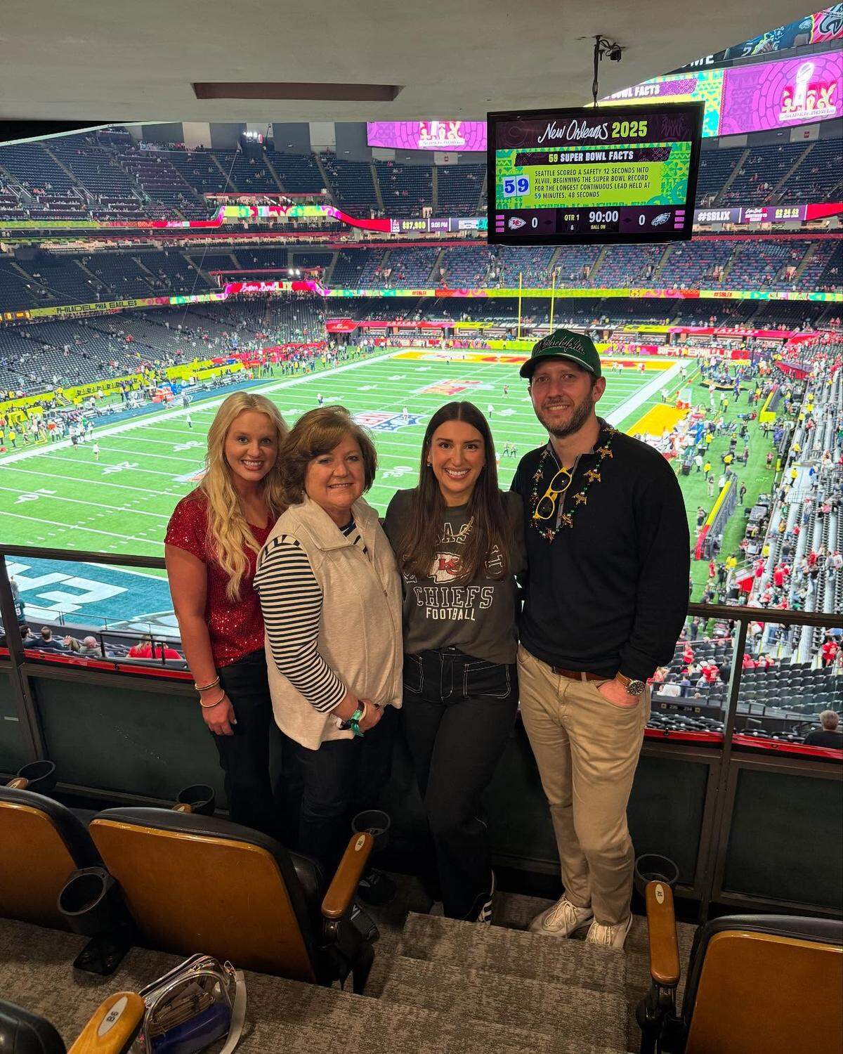 Trey and Taylor Spillman, right, pose for a photo inside a Super Bowl luxury box with two other House staffers.