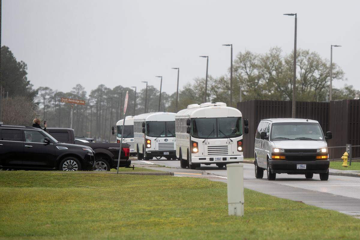 Buses carry members of Naval Mobile Construction Battalion 133 returning from deployment at a homecoming event at the Naval Construction Battalion Center in Gulfport on Tuesday, March 5, 2024.