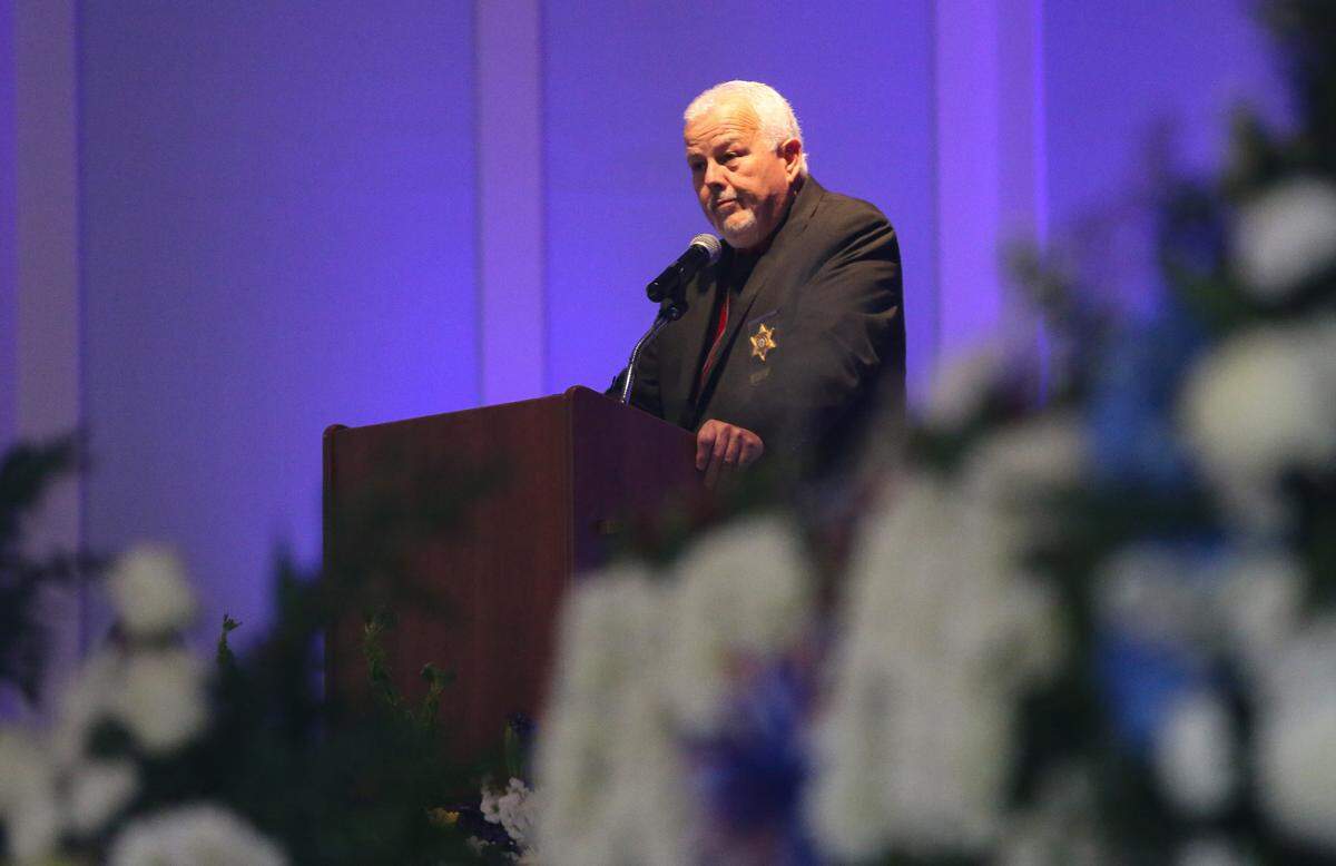 Sheriff Ricky Adam delivers the eulogy for Hancock County Sheriff’s Deputy Lt. Michael Boutte Tuesday, February 9, 2021, in the Bay St. Louis Community Hall. 