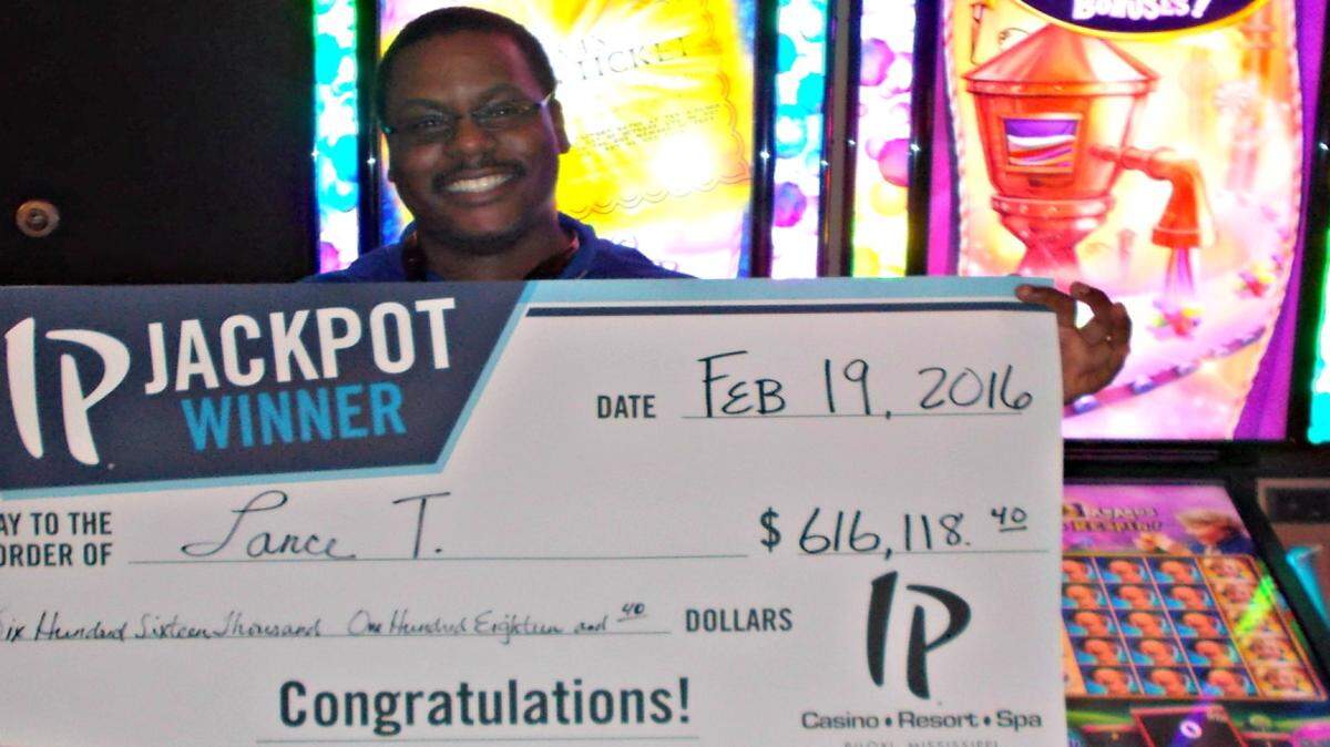 PHOTO COURTESY OF IP CASINO 
 Lance T. of Atlanta holds a celebration check after winning more than $616,000 at IP Casino Friday playing the Willy Wonka slot machine.