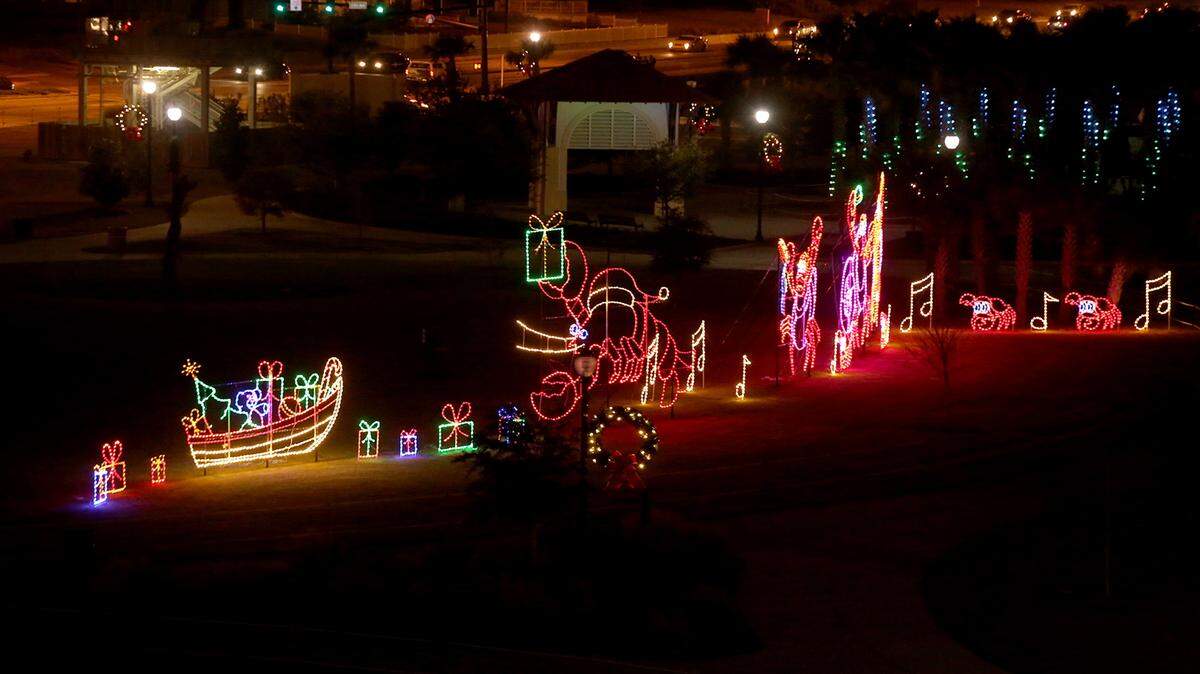 AMANDA McCOY/SUN HERALD 
 The lights shine in Jones Park for the very first night of the Gulfport Harbor Lights Winter Festival on Friday, November 27, 2015. Sponsor Island View Casino Resort agreed to spend $2.5 million on the show over five years. The show will run nightly through Jan. 3.