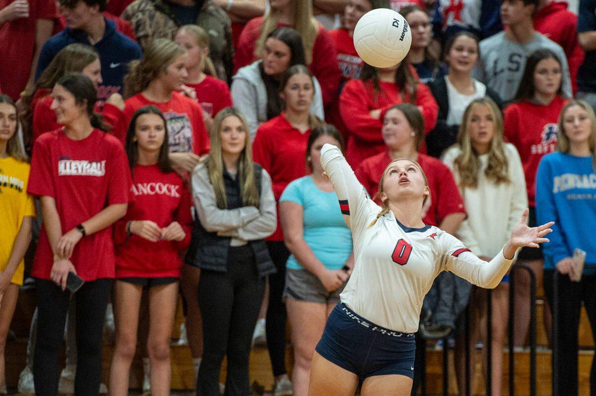 Hancock’s Josey Smith serves the ball over the net during the 6A South State Championship game at Hancock High School in Kiln on Monday, Oct. 16, 2023.