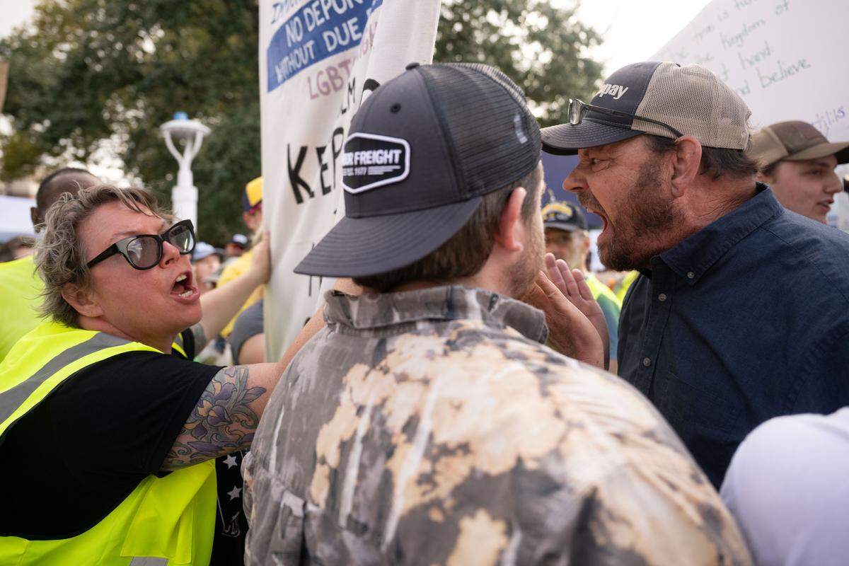 Protesters argue with a counter-protester at the No Kings rally Saturday in Gulfport.