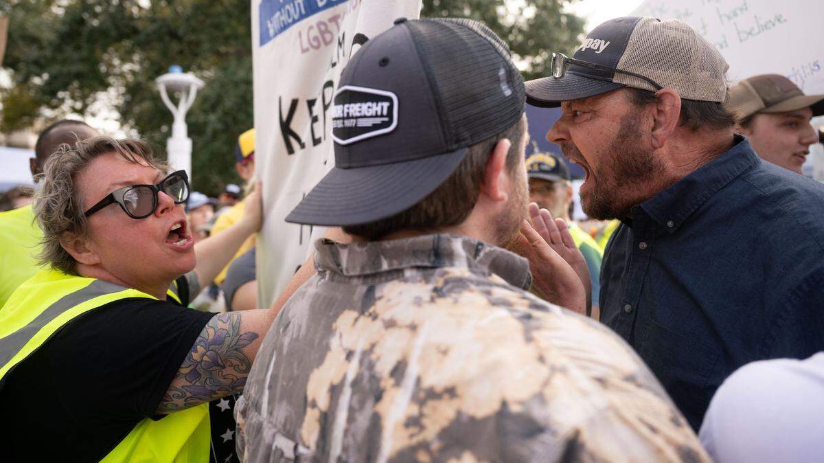 Protesters argue with a counter-protester during a No Kings event in Gulfport on Saturday, October. 18, 2025.