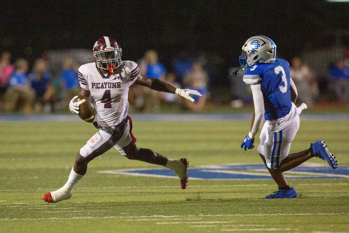 Picayune’s Darrell Smith runs the ball during a game between Picayune and Ocean Springs at Greyhound Stadium in Ocean Springs on Friday, Sept. 27, 2024.