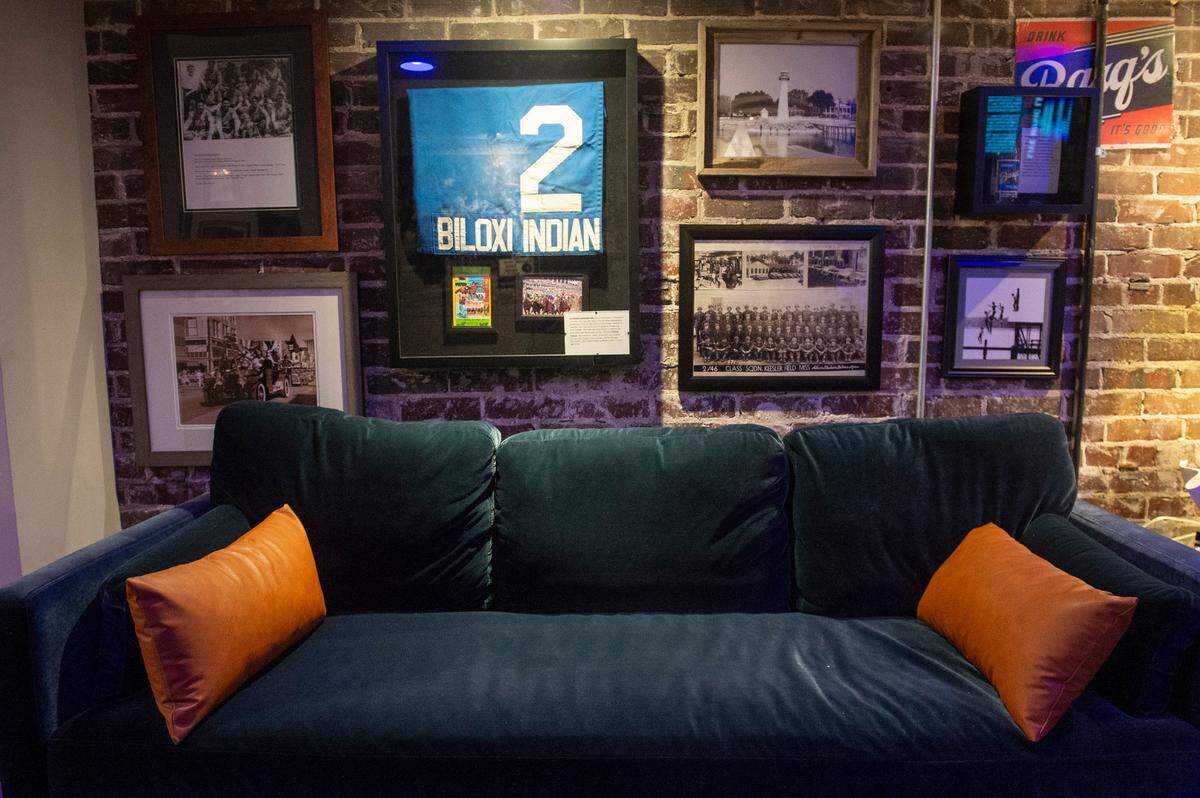 Photographs and memorabilia from Biloxi and the Mississippi Coast line the walls of Ground Zero’s new lounge space at their Biloxi location on Wednesday, May 21, 2025.