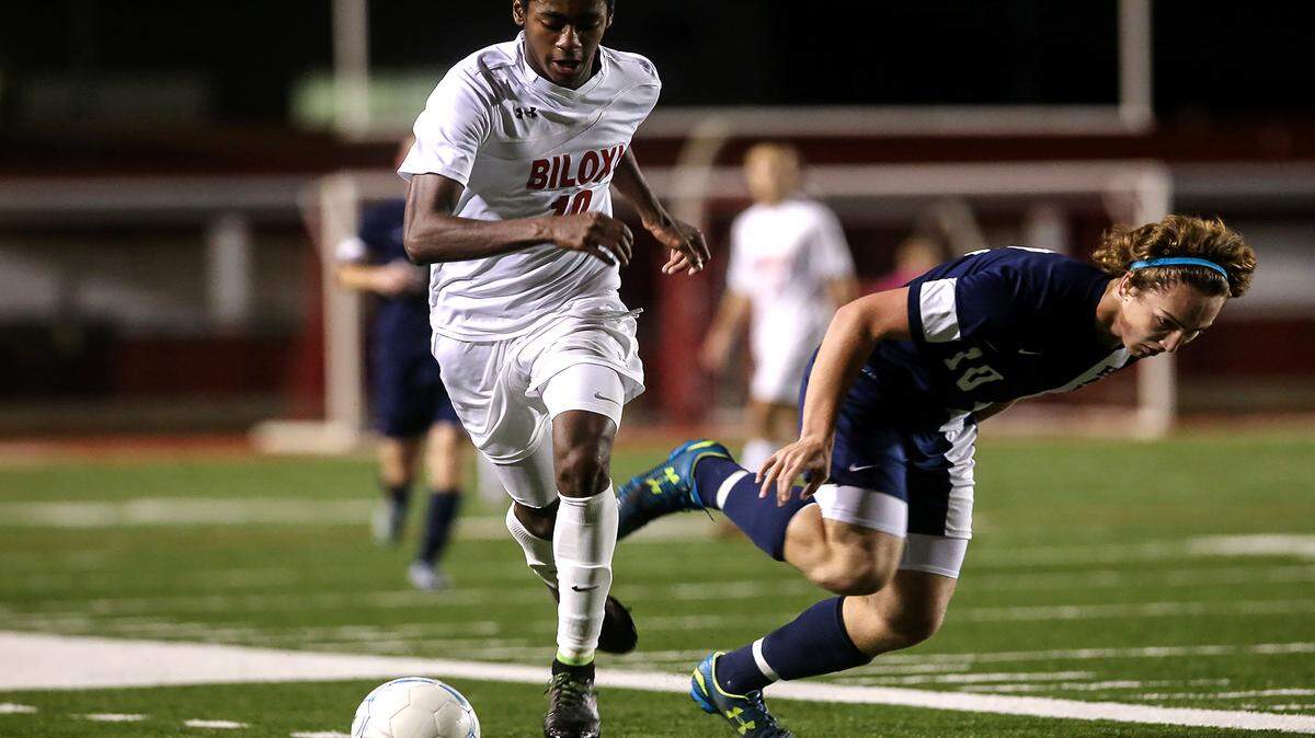 AMANDA McCOY/SUN HERALD 
 Biloxi's Marcus Kennedy dribbles the ball down the field while competing against Hancock High on Friday, January 15, 2016, at Biloxi High.