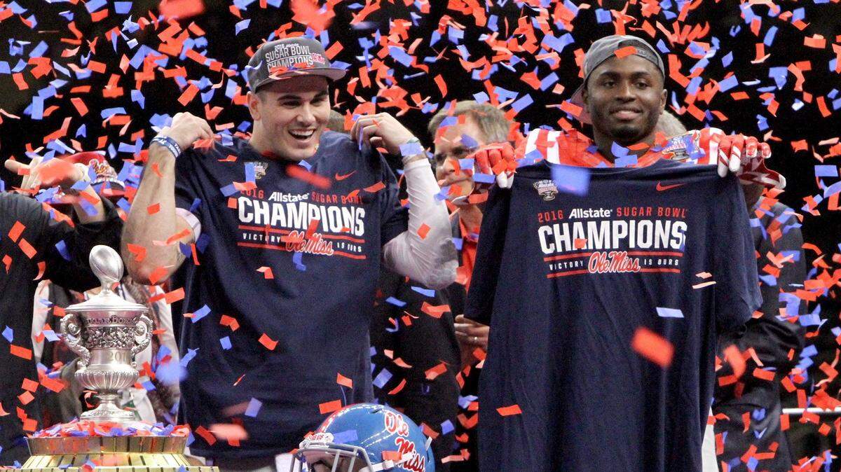 TIM ISBELL/SUN HERALD 
 Chad Kelly and Laquon Treadwell celebrate in a shower of red and blue confetti after Ole Miss defeated OSU at All State Sugar Bowl in New Orleans, Friday, Jan. 1, 2016.