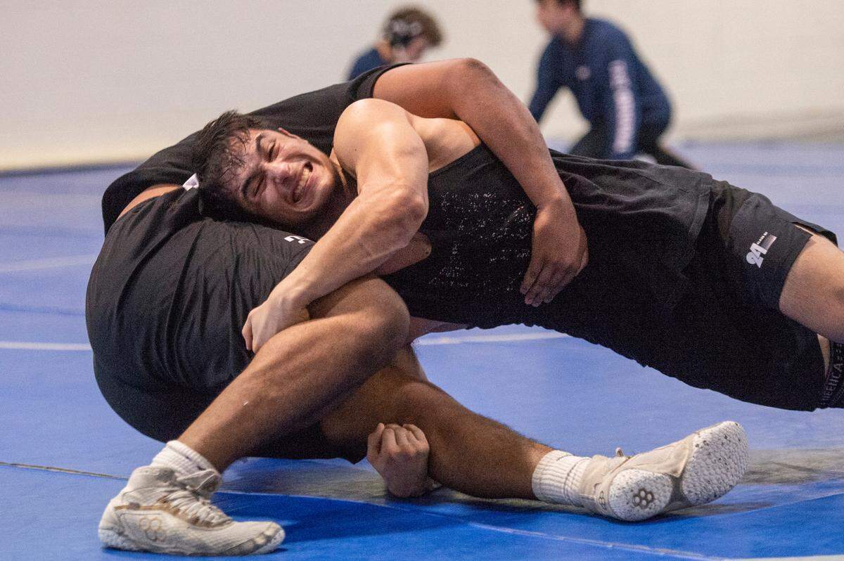 Xavier Smith and Trent Schlosberg practice wrestling moves on each other during Ocean Springs’ high school wrestling practice at E.H. Keys Alternative Education Center on Thursday, Feb. 8, 2024.
