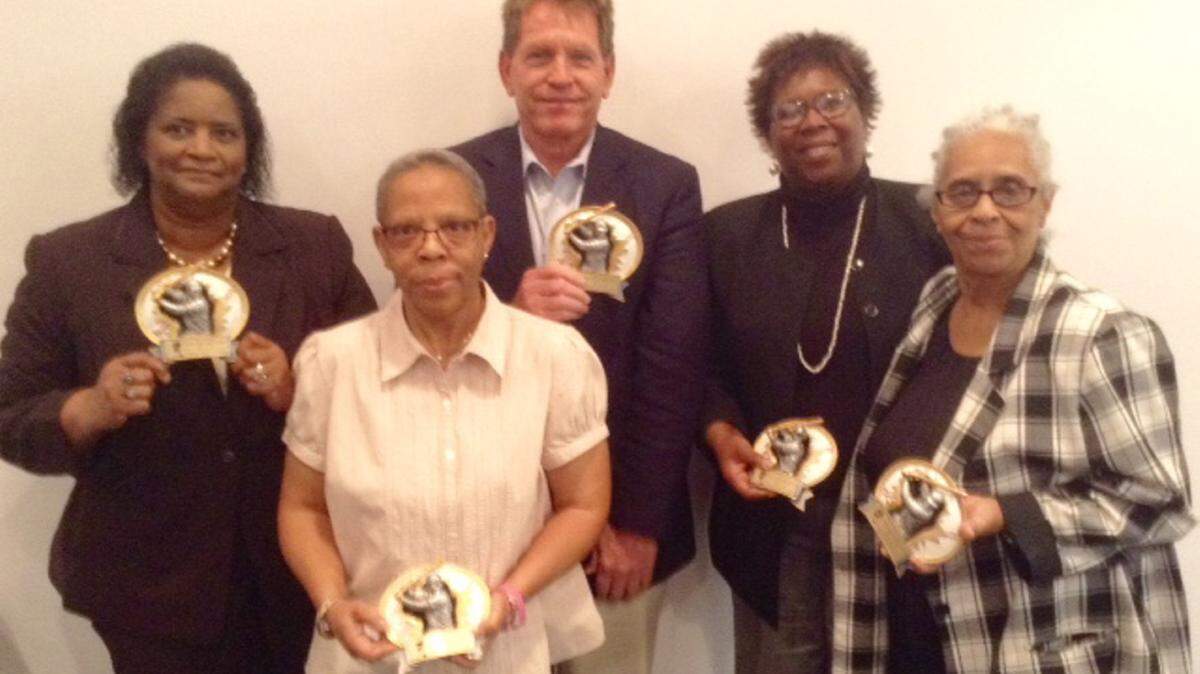 MAURICE SINGLETON/SPECIAL TO THE SUN HERALD 
 Award recipients Katherine Egland, left, Gail Whitney, Cliff Kirkland (receiving on behalf of William Windham), Kay Horne (receiving on behalf of Rosell Horne) and Ruth Story show off their awards during the Biloxi NAACP's second annual Spirit of Jackie Robinson awards presentation on Friday, April 15, 2016, at the Martin Luther King Municipal Building in Biloxi.