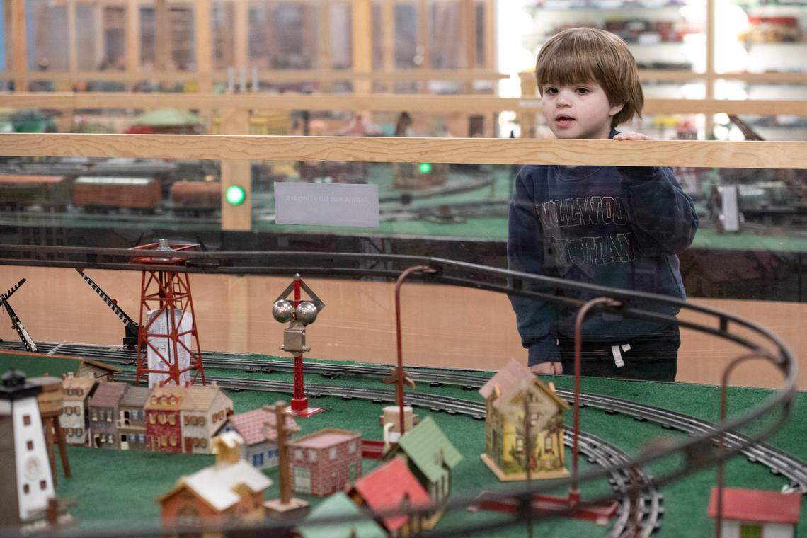 James Powell, of Mobile, Ala., watches a model train during a preview night for TrainTastic’s Holiday Lights event at TrainTastic Interactive Model Railroad Museum in Gulfport on Wednesday, Dec. 4, 2024.
