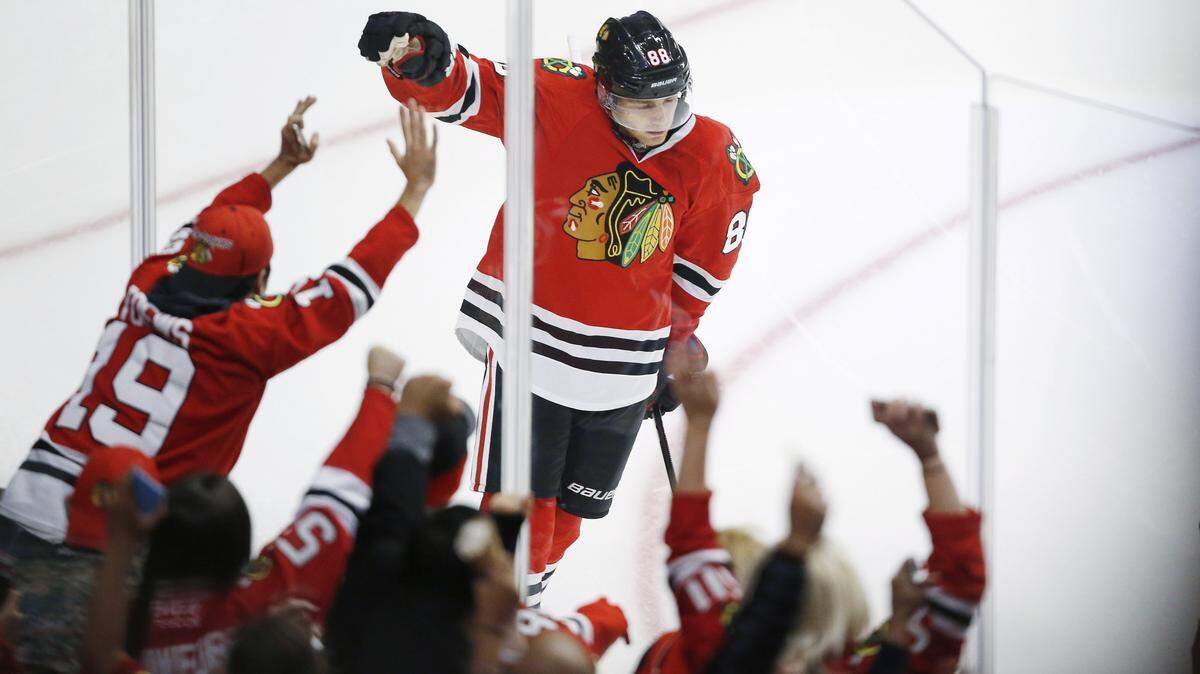 Chicago Blackhawks right wing Patrick Kane (88) celebrates his goal against the Dallas Stars during the third period of a preseason NHL hockey game Saturday, Oct. 3, 2015, in Chicago. (AP Photo/Andrew A. Nelles)