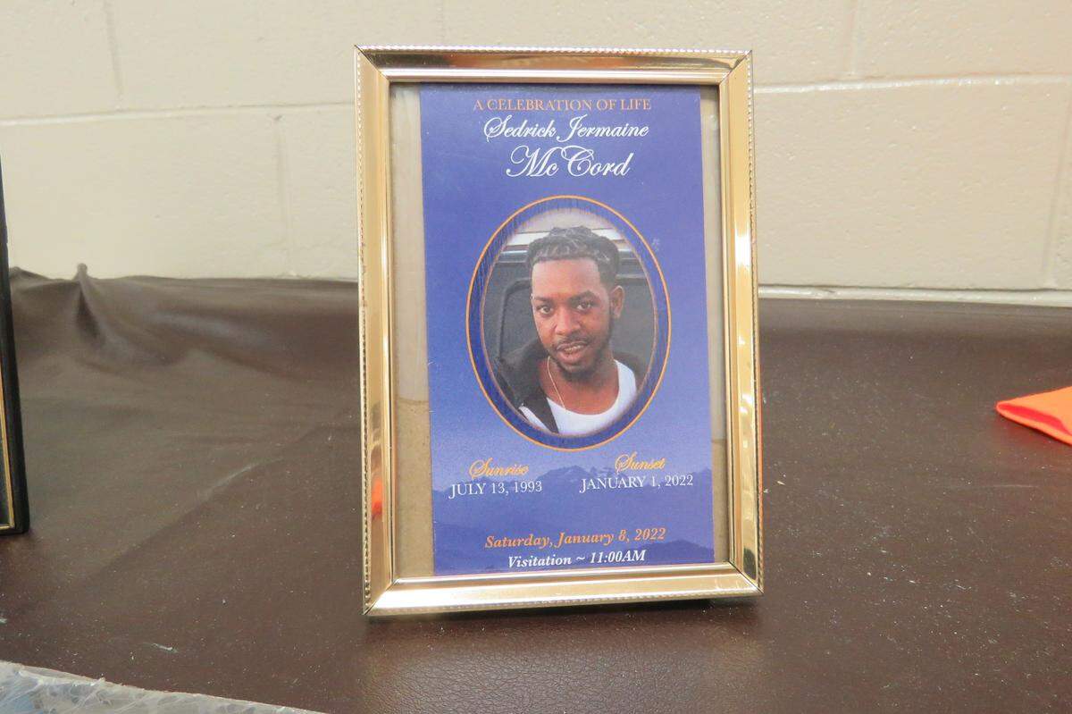 At the Gaston Point community meeting on Jan. 11, 2022, Christene Bryce set up a memorial to Gulfport’s victims of gun violence, including Sedrick McCord, one of four people killed at a New Year’s Eve party.