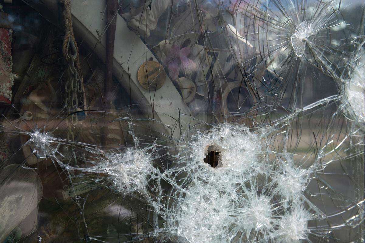 A shattered glass panel on the Hurricane Katrina memorial at Biloxi Town Green makes it nearly impossibly to see what’s inside. This is the third time in 19 years the memorial was vandalized.