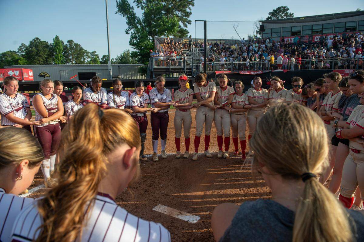 East Central and Lafayette pray together after East Central won the MHSAA 5A Softball Championship at USM Softball Complex in Hattiesburg on Wednesday, May 14, 2025.